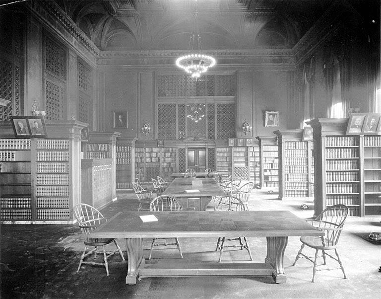 Reading tables and shelved case reporters in the Temple of Justice law library, Olympia